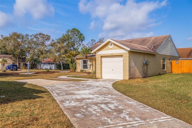 view of front of property with a garage and a front yard