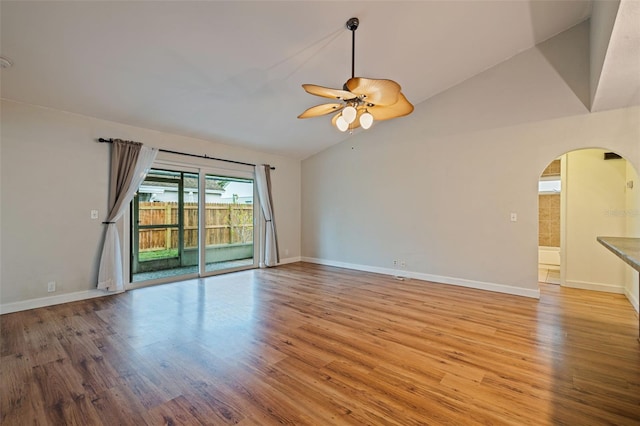 unfurnished living room with ceiling fan, light hardwood / wood-style flooring, and vaulted ceiling