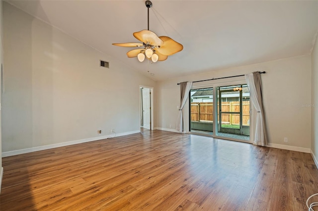 spare room featuring light wood-type flooring, ceiling fan, and high vaulted ceiling