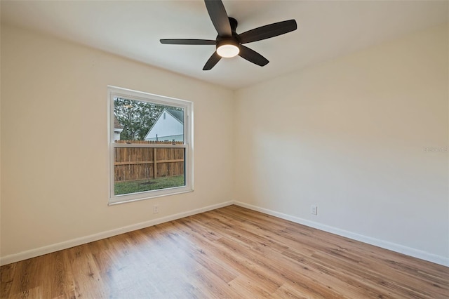 unfurnished room featuring ceiling fan and light wood-type flooring