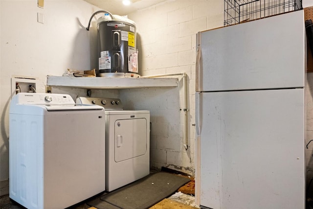 laundry area with electric water heater and washer and clothes dryer