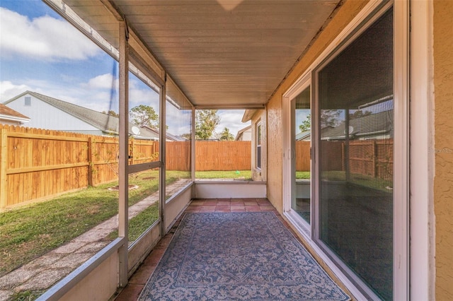 unfurnished sunroom featuring wooden ceiling