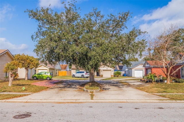 view of front facade featuring a garage and a front yard