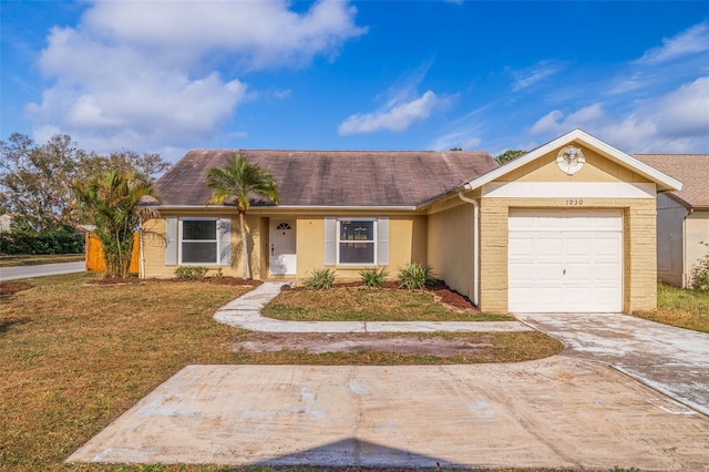 ranch-style home featuring a garage and a front yard