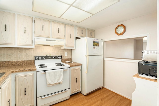 kitchen featuring decorative backsplash, white appliances, and light hardwood / wood-style flooring