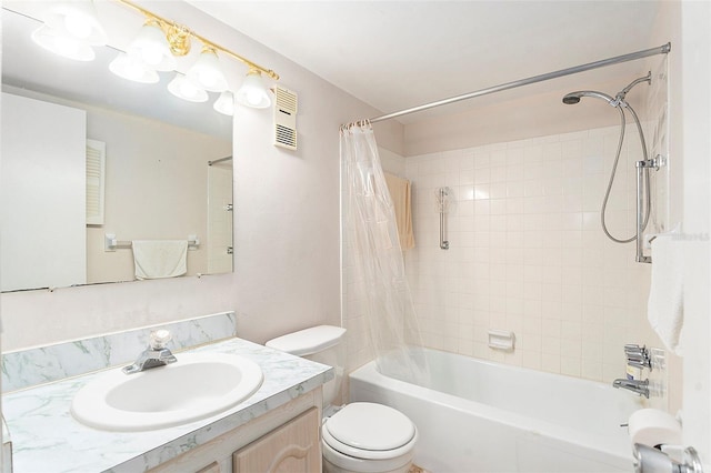 full bathroom with vanity, toilet, and shower / tub combo with curtain