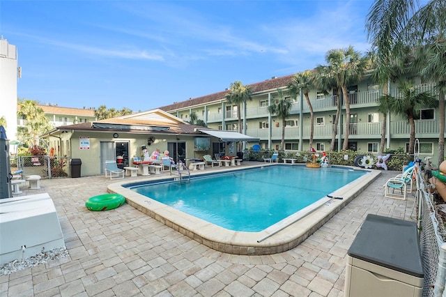 view of swimming pool featuring a patio