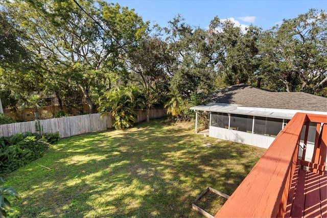 view of yard with a sunroom