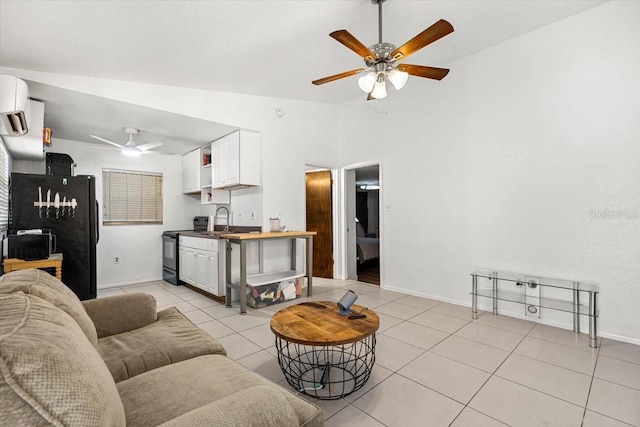 living room featuring a wall mounted AC, ceiling fan, sink, light tile patterned floors, and lofted ceiling