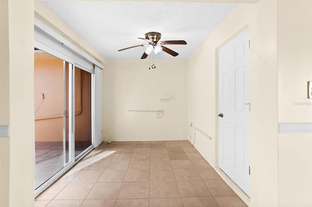 hall featuring light tile patterned floors