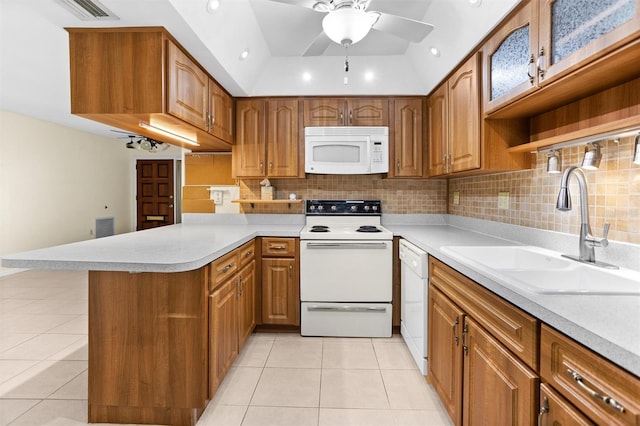 kitchen with kitchen peninsula, white appliances, ceiling fan, sink, and light tile patterned floors