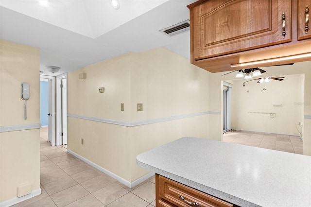 kitchen featuring ceiling fan and light tile patterned flooring