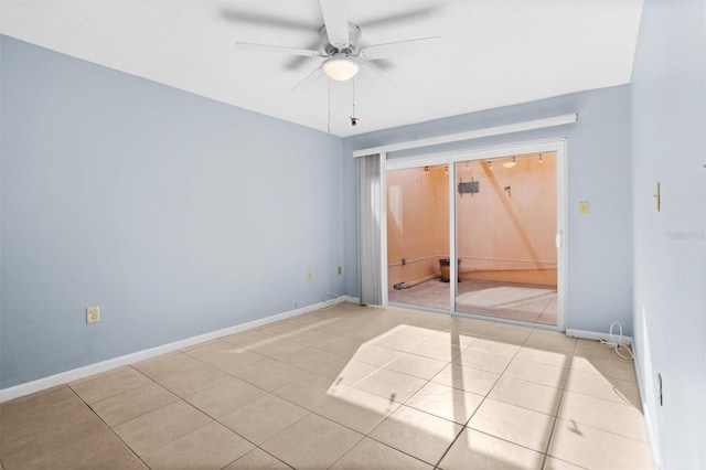 tiled empty room with ceiling fan