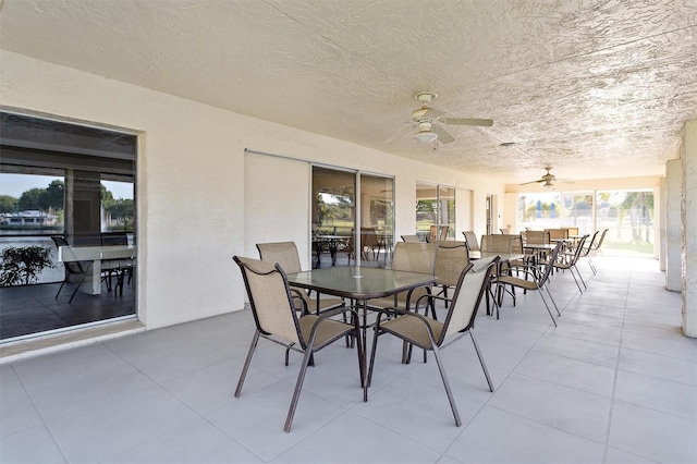 dining room with ceiling fan and light tile patterned floors