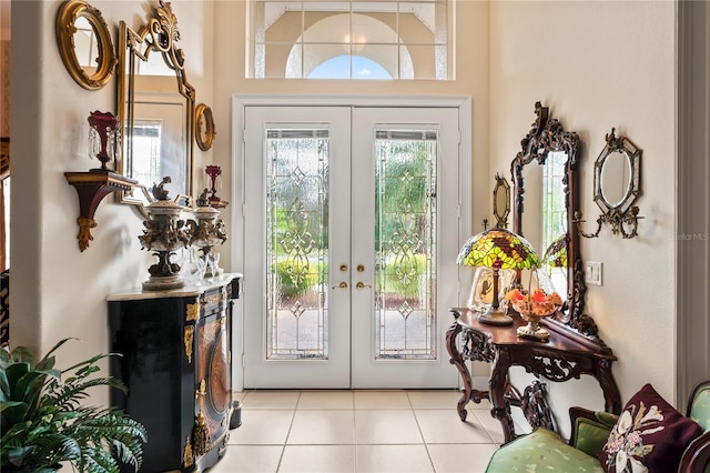 doorway to outside featuring light tile patterned flooring and french doors