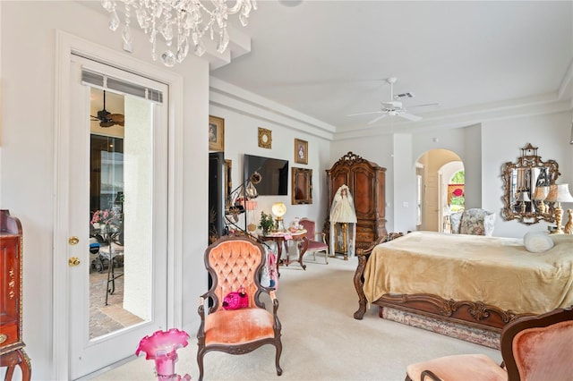 bedroom featuring ceiling fan with notable chandelier and light colored carpet