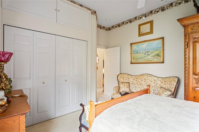 bedroom with ceiling fan and a closet