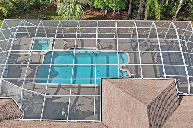 view of swimming pool with a lanai