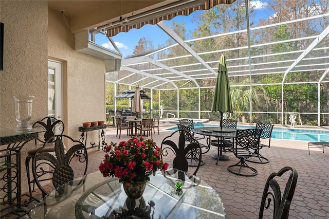 view of patio / terrace with glass enclosure