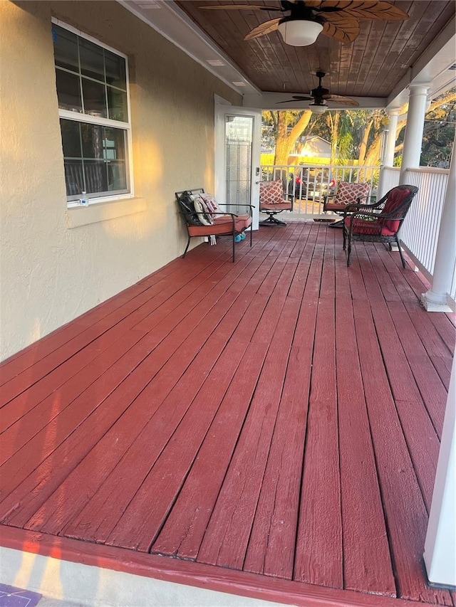 wooden deck featuring ceiling fan and covered porch