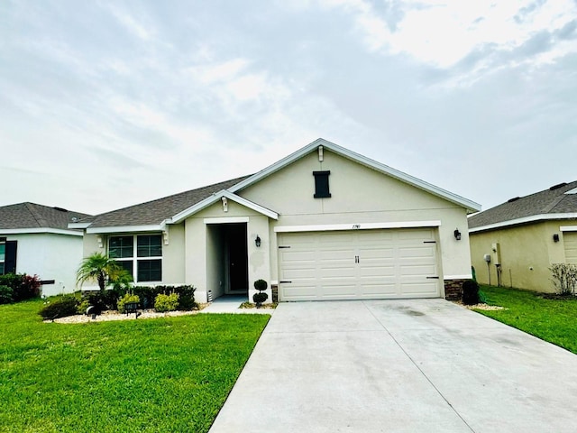 single story home with a garage and a front lawn