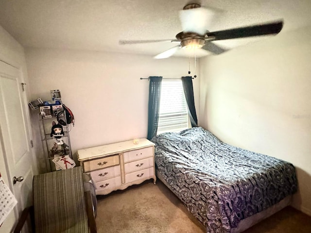 bedroom with dark carpet and ceiling fan