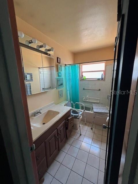 full bathroom with toilet, vanity, tile patterned floors, and shower / bath combo with shower curtain