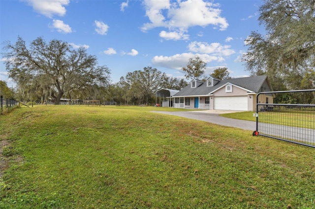 view of front of property with a front lawn and a garage