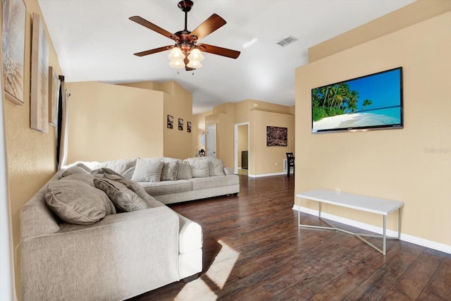 living room with lofted ceiling, ceiling fan, and dark wood-type flooring