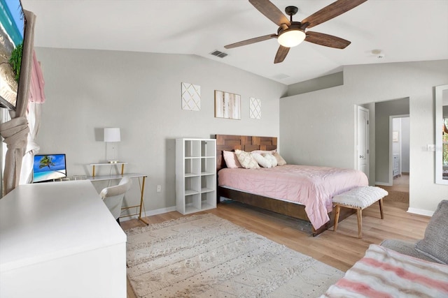 bedroom with ceiling fan, light hardwood / wood-style floors, and lofted ceiling