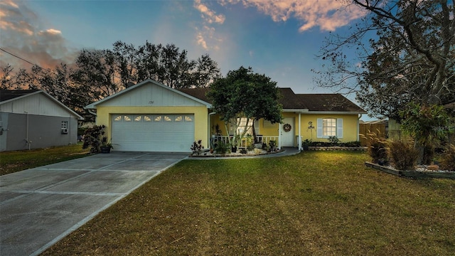 ranch-style home with a lawn and a garage