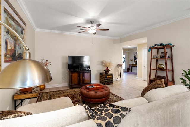 living room featuring ceiling fan and crown molding