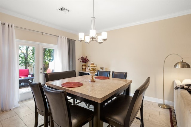 dining area with a chandelier, light tile patterned floors, and ornamental molding