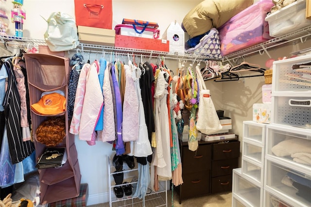 walk in closet featuring carpet floors