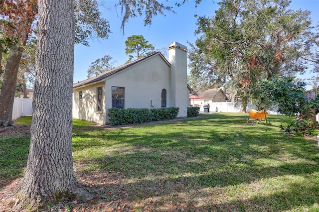 view of property exterior featuring a yard