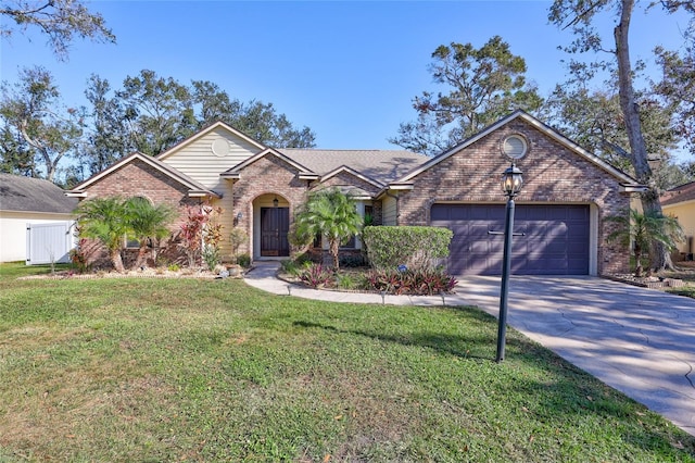 view of front of home featuring a garage and a front lawn