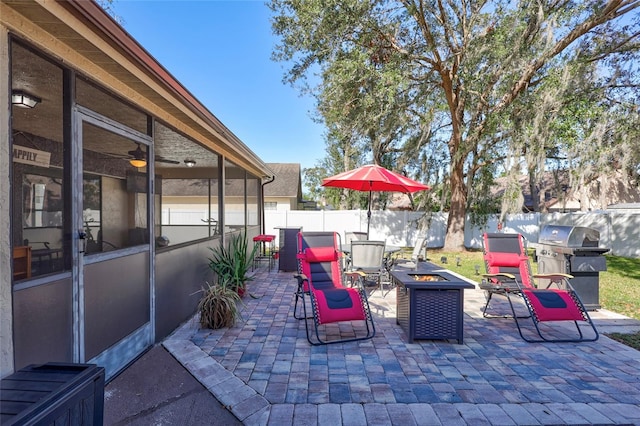 view of patio / terrace featuring area for grilling and an outdoor fire pit