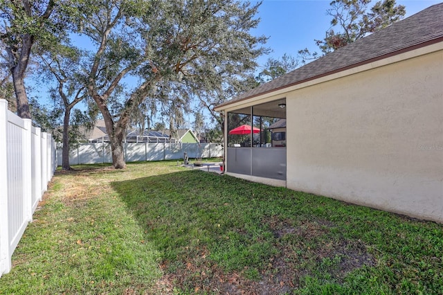 view of yard featuring a sunroom