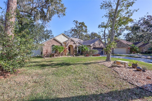 ranch-style home featuring a garage and a front lawn