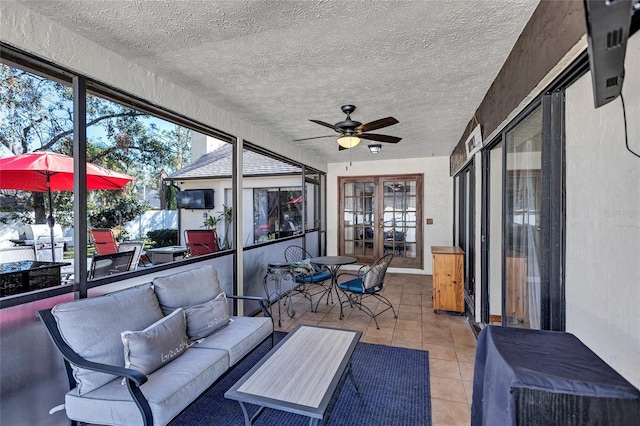 sunroom / solarium with ceiling fan