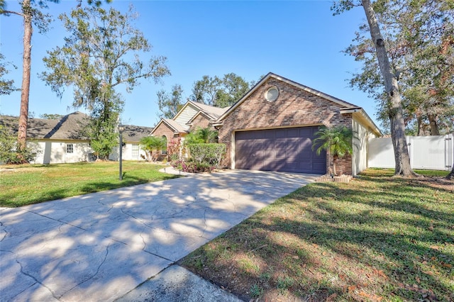 view of front of home featuring a garage and a front lawn