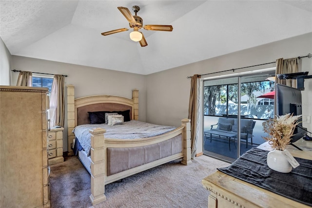 carpeted bedroom featuring access to outside, ceiling fan, a textured ceiling, and vaulted ceiling