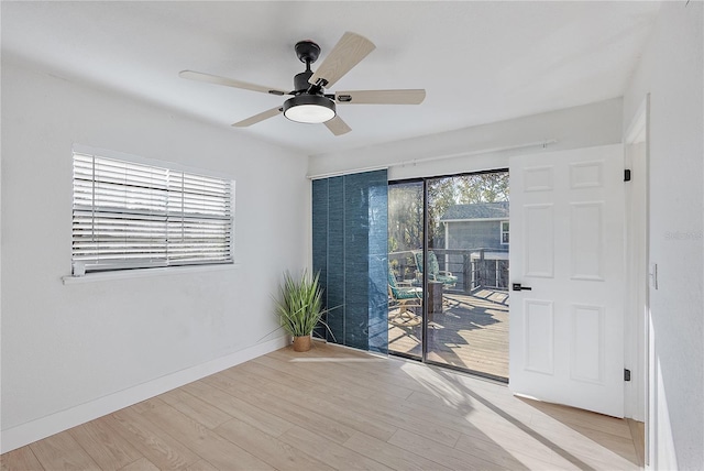 empty room featuring ceiling fan and light hardwood / wood-style floors