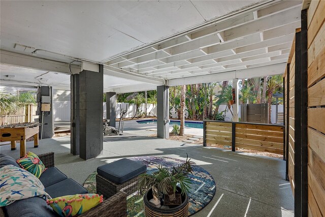 view of patio with a fenced in pool