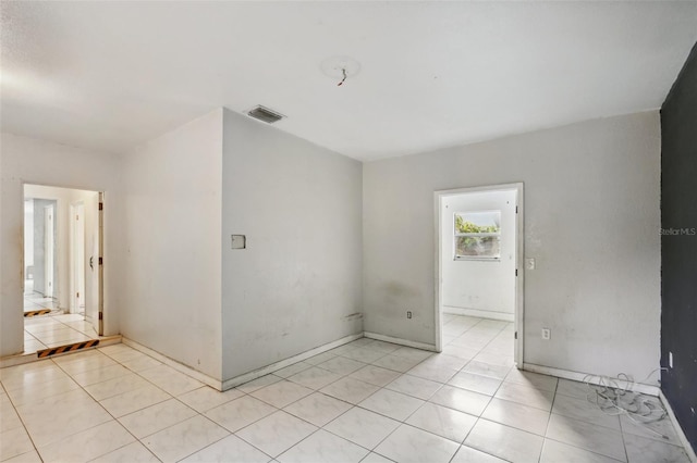 empty room featuring light tile patterned floors