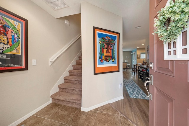 foyer with dark hardwood / wood-style floors