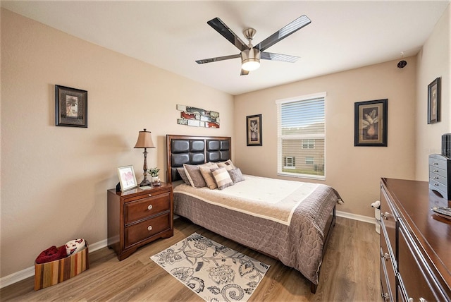 bedroom featuring light hardwood / wood-style floors and ceiling fan