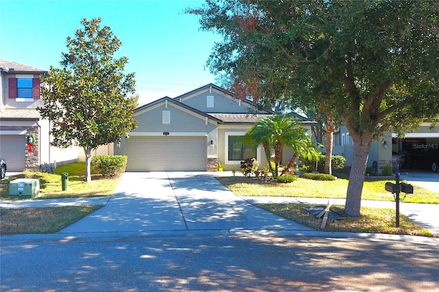 view of front facade with a front yard and a garage