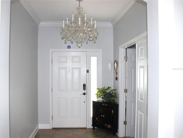 entrance foyer with a chandelier and ornamental molding