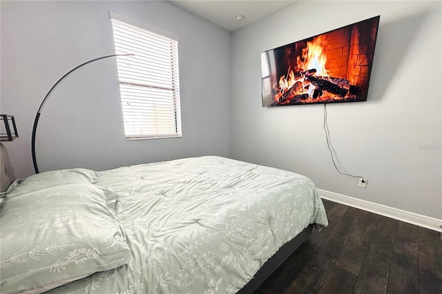 bedroom featuring dark hardwood / wood-style flooring